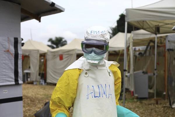 A health worker in protective gear works at an Ebola treatment center in Beni, Eastern Congo.