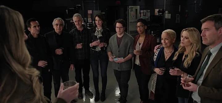 A group of actors holding drinks.