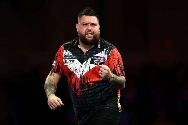 LONDON, ENGLAND - DECEMBER 19: Michael Smith of England reacts against Kevin Doets of Netherlands in their second round match during day five of the 2024/25 Paddy Power World Darts Championship at Alexandra Palace on December 19, 2024 in London, England. (Photo by James Fearn/Getty Images)