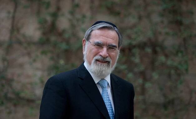 rabbi sacks nature behind him leaves branches