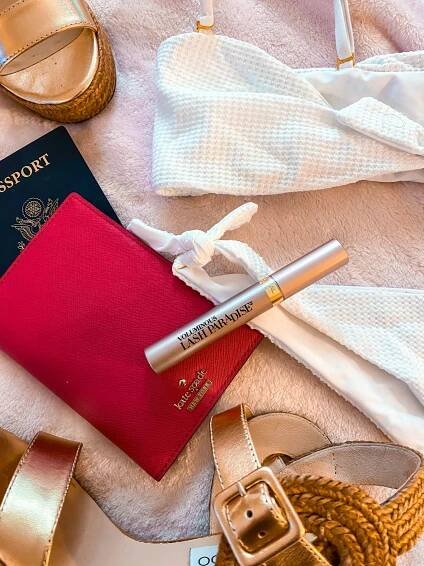 l'oreal lash paradise mascara travel flatlay free luggage tag beach bunny swimwear white bikini
