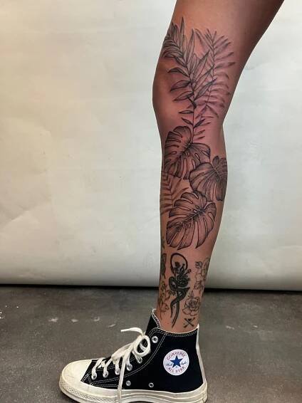 Monstera Palm Leg Tattoo in 2025 | Leg tattoos women, Tattoos, Body tattoos