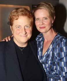 Christine Marinoni and wife Cynthia Nixon pose at the opening night after party for The New Group Theater production of "The True"