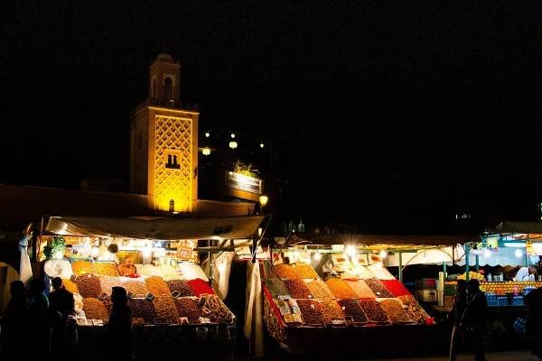 Spices and Minaret lit up in the Marrakech Medina.