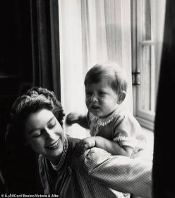 Following the dutiful austerity of their wartime portraits, Beaton¿s more intimate, less formal photos of the royal family from the 1950s onwards helped update their public image. Princess Elizabeth with Prince Charles (aged 22 months) at Clarence House, 14 September 1950.