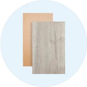 A piece of light wood-look flooring and a piece of gray wood-look flooring.
