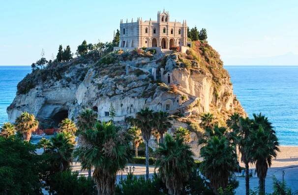 Former 4th century monastery on top of the Sanctuary of Santa Maria Island - Tropea, Calabria, Italy. Tropea Beach at Tyrrhenian Sea.