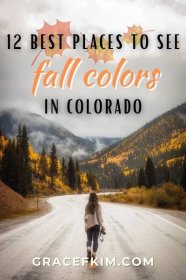 a woman walking down the middle of a road with fall colors in colorado behind her