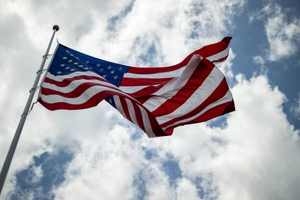 President Donald Trump watches as the American flag is raised on the newly-installed flagpole on the South Lawn of the White House, Wednesday, June 18, 2025. (Official White House Photo by Daniel Torok)