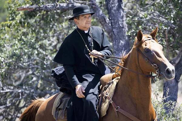 Sebastian Roche as Father Renaud in season 2, episode 1 of 1923 streaming on Paramount+.