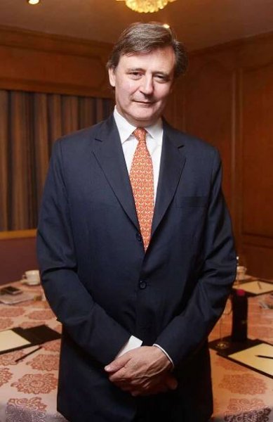 Editor-In-Chief at Bloomberg LP John Micklethwait poses during an exclusive interview on November 3, 2015 in Mumbai, India. 