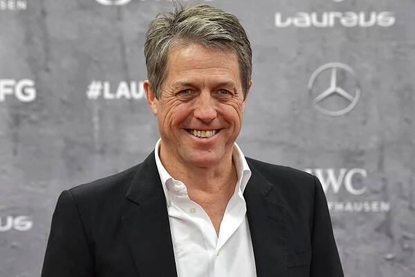 Hugh Grant Jokes About Cutting His Kids' Hair in Quarantine: 'Strapped Them to a Chair'