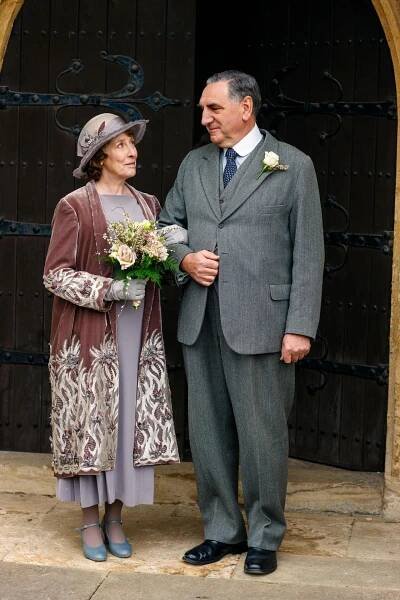 Phyllis Logan (as Mrs Hughes): Velvet wedding coat and dress, worn for the marriage of Mrs Hughes to Mr Carson Season 6, Episode 3 8 image 7 - © Carnival Film & Television Limited