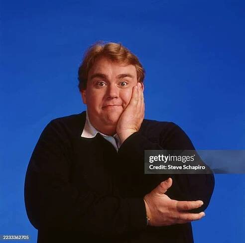 Promotional portrait of Canadian actor John Candy , against a blue background, for the film 'Delirious' , Los Angeles, California, 1990.