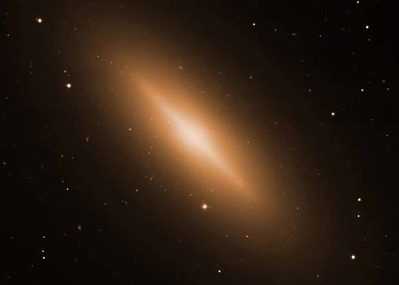 This composite image contains X-rays from Chandra (blue) and optical data from the VLT (gold) of the galaxy NGC 3115.  Using the Chandra data, the flow of hot gas toward the supermassive black hole in the center of this galaxy has been imaged. This is the first time that clear evidence for such a flow has been observed in any black hole. The new Chandra data also supports the previous optical observations that suggest that NGC 3115's black hole has a mass of about two billion times that of the Sun.  This would make NGC 3115 the host of the nearest billion-solar-mass black hole to Earth.
