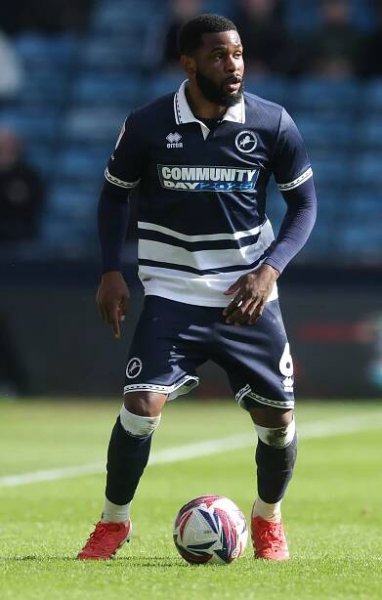 Japhet Tanganga of Millwall FC on a soccer field.
