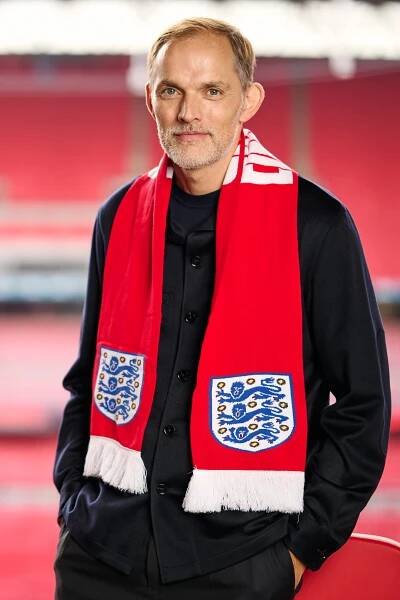 Thomas Tuchel, new England manager, wearing a red scarf with the England crest.