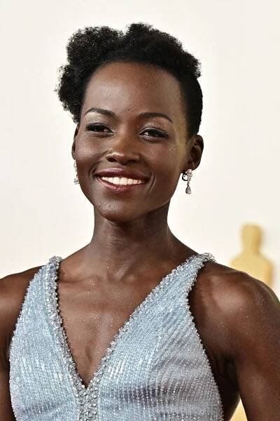 Here’s How Lupita Nyong’o Got Her Y2K Body Shimmer at the 2024 Oscars — See Photos