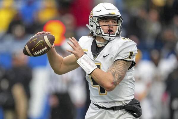 Appalachian State quarterback Joey Aguilar (4) passes the ball during an NCAA football game on Saturday, Nov. 11, 2023, in Atlanta. (AP Photo/Jason Allen)