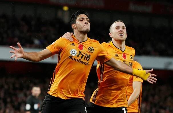 Raul Jimenez and Diogo Jota celebrating a goal.