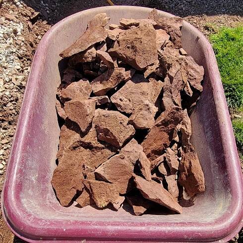 all shale! the ground at this job was insanely difficult to work with but we got it done! Photo of wheelbarrow full of shale that was removed from site to make room for future walkway