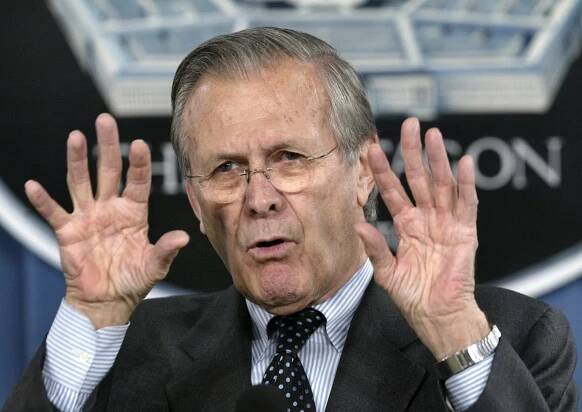 Secretary of Defense Donald Rumsfeld gestures during news briefing at the Pentagon.