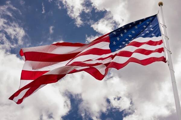 President Donald Trump watches the United States flag is raised on the newly installed flagpole on the South Lawn of the White House, Wednesday, June 18, 2025. (Official White House Photo by Andrea Hanks)