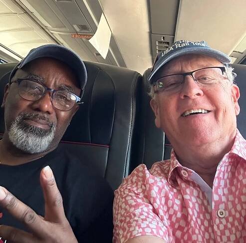 Jarvis Harris, left, and Joe Foss on one of the many Amtrak coaches that carried them across America.