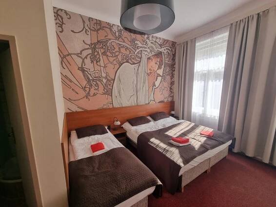 Posteľ alebo postele v izbe v ubytovaní Hotel Klara