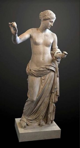 a statue of a man holding something in his hand
