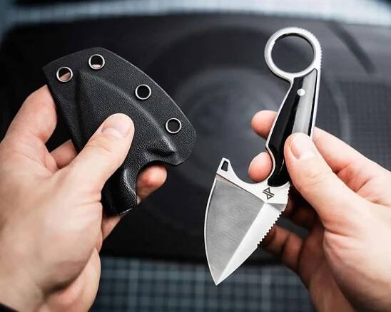 Böker Magnum Enki and kydex sheath held in two hands