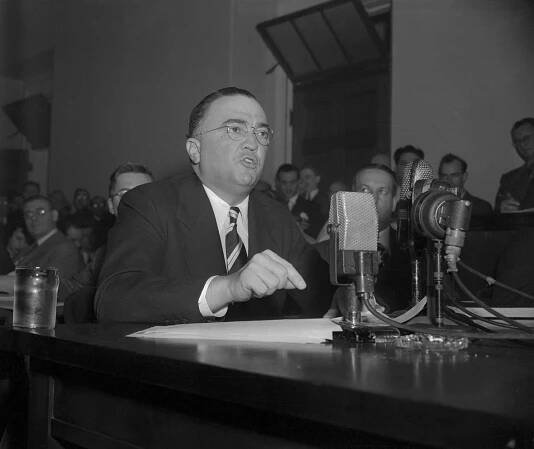 FBI Director, J. Edgar Hoover, today gave the House Un-American Activities Committee a blunt story regarding the working of the Communist party in this country. Hoover declared that the Communist party in the US seeks to overthrow our form of government by bloody revolution. This photo shows Mr. Hoover as he appeared before the committee.