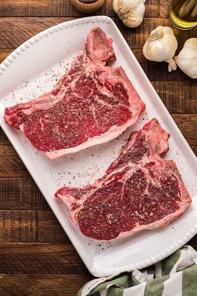 T-bone steaks with pepper.