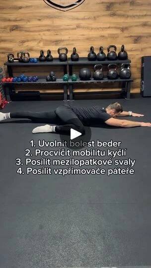 a woman is doing exercises on the floor in front of a wall with kettles