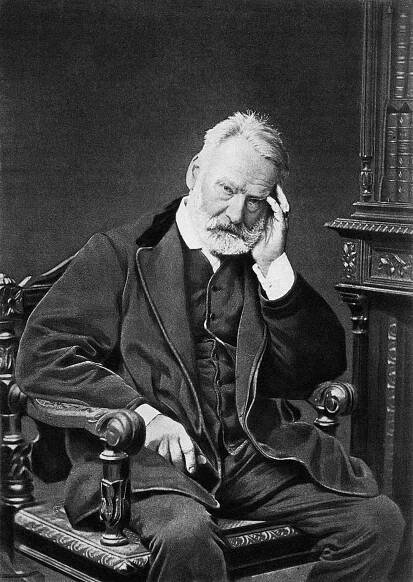 Victor Hugo sitting in a chair