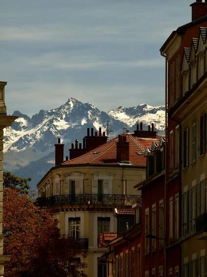 a view of a snow covered mountain from a building