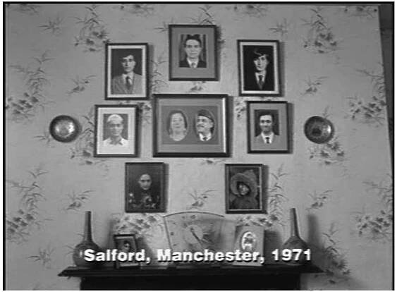 cuses on the 1970s and hence is a retrospect portrait of a Muslim family of six sons and one daughter in working-class Salford. In terms of genre, the movie can be described as a tragicomedy with grotesque elements.1* However, the film was advertised as a funny multi-cultural family movie and viewers might not have ex- pected the scenes of brutal domestic violence. Judging from the colourful movie posters and trailers that highlighted the comic aspects of the movie, scenes such as when the dog attacks Mrs Shaw (Leena Dhingra) and her grotesquely ugly daughters, viewers might have been misled. In many respects, it seems as if the Muslim father simply cannot be depicted without irrational aggressive outbursts at his family. Once more, the father figure is featured prominently, and interest- ingly, this character is played again by the actor Om Puri, who now stars as the patriarch George. Nonetheless, the two characters represent quite different models of patriarchy. Even if George and Parvez are both immigrants to Britain with a Pakistani background,?3 they are not of the same generation: George came to the UK in the 1930s and has adult sons in 1970. The war between India and Pakistan over the independence of East Pakistan features prominently in the film (although there are even more references to it in the play). Even if there are less explicit allusions to historical events in My Son the Fanatic, Parvez must have come to the country after WWII and has an adult son in the late eighties/early nineties.1* Both of them have low paying but labour-intensive jobs: Parvez works all night as a taxi driver and George owns an all-English fish and chip shop. His whole family — most significantly his English wife Ella (Linda Bassett) — have to work in the family business. Especially in their religious background and moral ideals, the characters could not be more drastically opposed: while Parvez dreams of the marriage between his son and the daughter of the English chief in- spector Fingerhut, George insists unsuccessfully that his sons enter an arranged marriage with a suitable Pakistani bride. The familial conflict is revealed when the eldest son, Nazir (lan Aspinall), runs away from his arranged marriage at the very last minute to the embarrassment of his whole family because it signifies his failure to fulfil his filial duty. Consequently, his portrait disappears and is shown to fade away from the family gallery (cf. illustration 3) leaving only the smpty spot on the wall.  