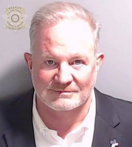 In this handout provided by the Fulton County Sheriff's Office, Scott Hall, a bail bondsman facing charges over a voting system breach in early 2021 poses for his booking photo on August 22, 2023 in Atlanta, Georgia