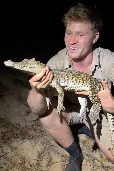 Robert Irwin with crocodile