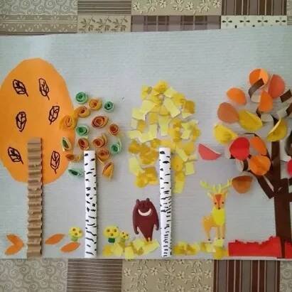 an art project with paper trees and animals