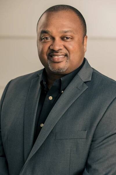 man with goatee and gray suit jacket  