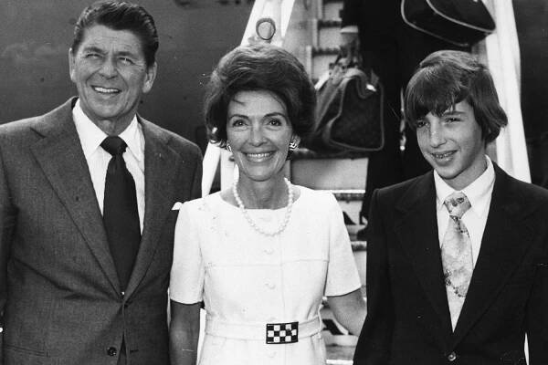 American politician, Ronald Reagan, Republican Governor of California and former filmstar, arriving at Heathrow airport, London with his wife Nancy and son Ronald Jnr. He later became 40th President of the United States of America (1980 - 1988)