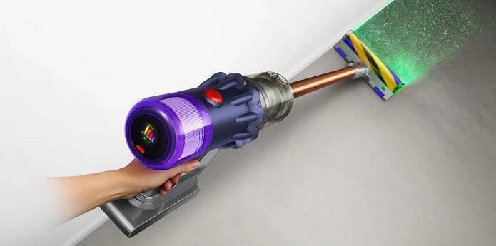 Close-up of hand holding the Dyson V12 Detect Slim vacuum