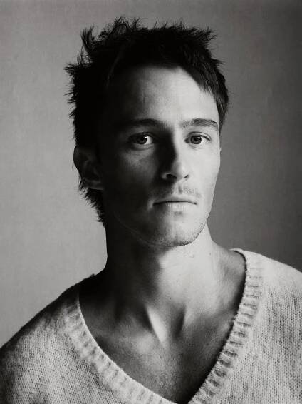 a portrait of a person with obscured features showcasing their neck and shoulders