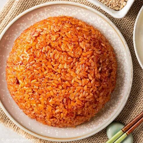 a plate of Vietnamese red sticky rice (xoi gac)