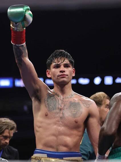 Ryan Garcia celebrates defeating Emmanuel Tagoe at the Alamodome on April 09, 2022 in San Antonio, Texas. 
