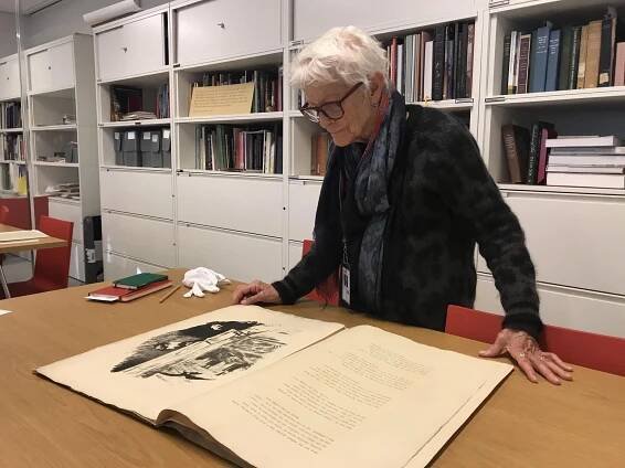 Joan Jonas looking at a special printed portfolio of The Raven by Edgar Allan Poe, with illustrations by Édouard Manet, published in Paris, 1875.