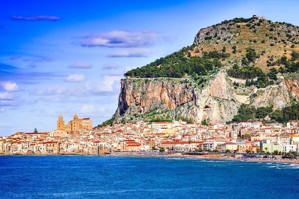 Cefalù, Sicily: coastal city and medieval cathedral on a rocky hillside overlooking the Ligurian Sea.