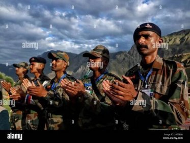 July 25, 2023, Drass Kashmir, India : Indian army soldiers clapping during 'Vijay Diwas' or victory day celebration in Drass, about 160 km (99 miles) east of Srinagar. The Indian army commemorates 'Vijay Diwas' annually in memory of more than 500 soldiers who were killed thirteen years ago during a war with Pakistan. The war took place in the mountains of the Kargil and Drass sectors, at the Line of Control or a military ceasefire line, which divided Kashmir between the two south Asian rivals. On July 25, 2023 in Drass Kashmir, India.(Photo By Firdous Nazir/Eyepix Group) Stock Photo