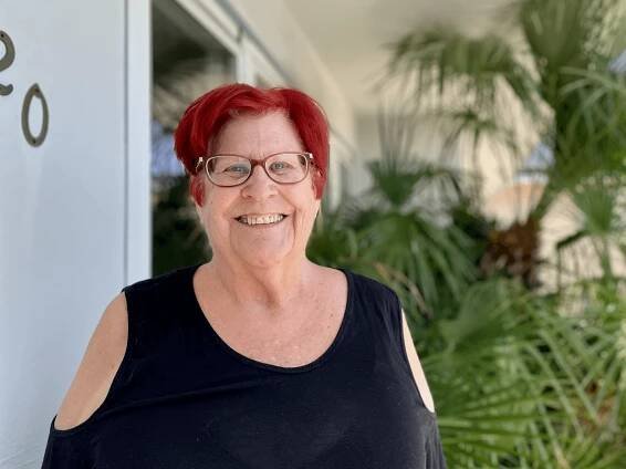 Mary Skinner poses outside her home, happy and confident after working with Live Life Physiotherapy.
